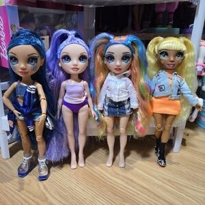 4 Rainbow Dolls And Clothing Bundle